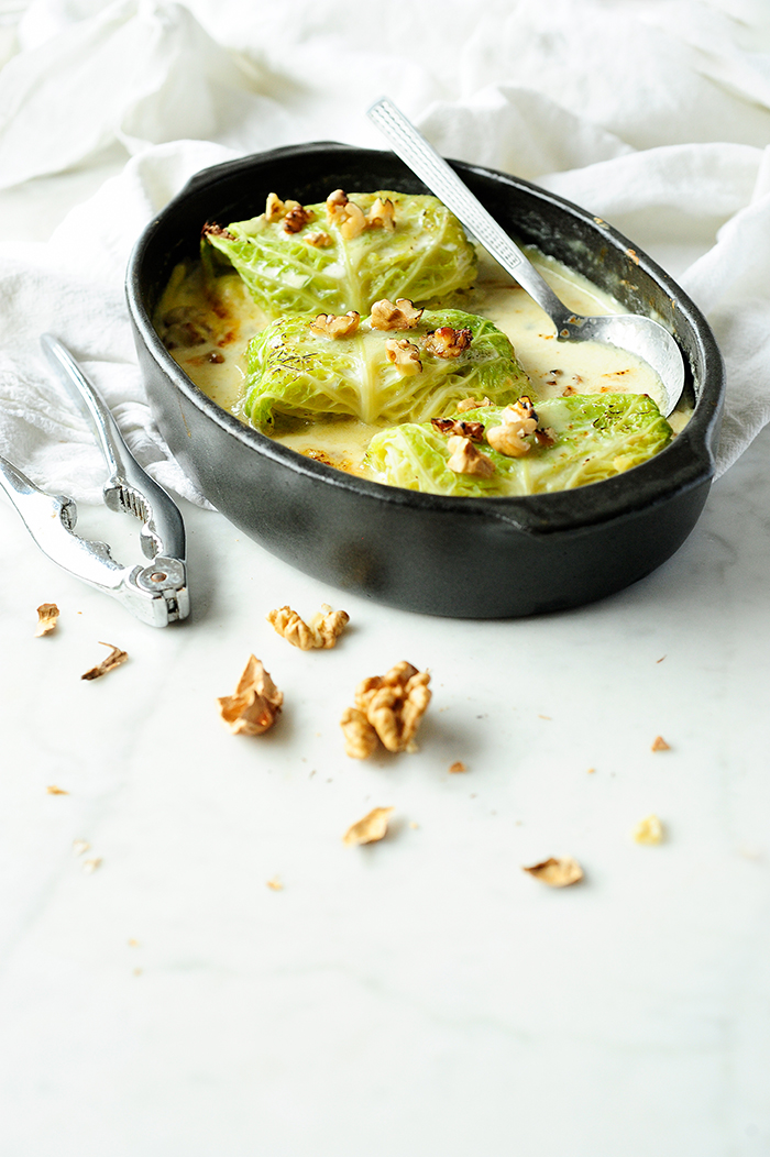 serving dumplings | Potato, chicory and pear stuffed cabbage with gorgonzola sauce 