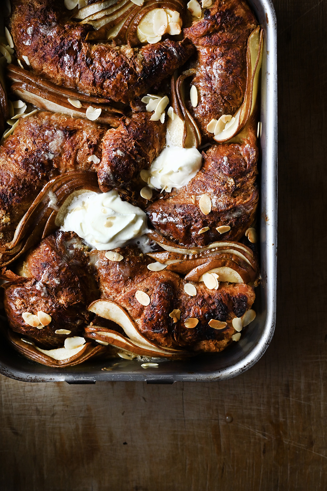 serving dumplings | Overnight pear and ricotta croissant French toast with almonds