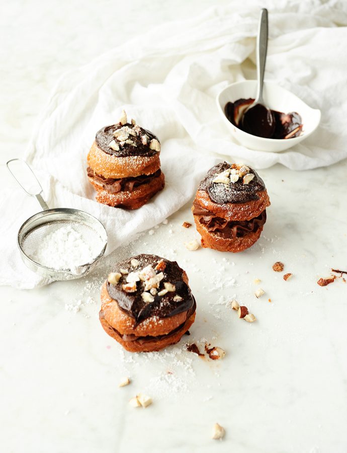 Polish donuts with chocolate mousse and hazelnuts