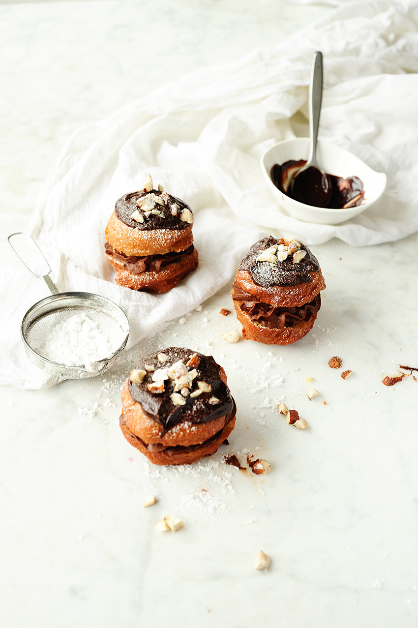 Polish donuts with chocolate mousse and hazelnuts