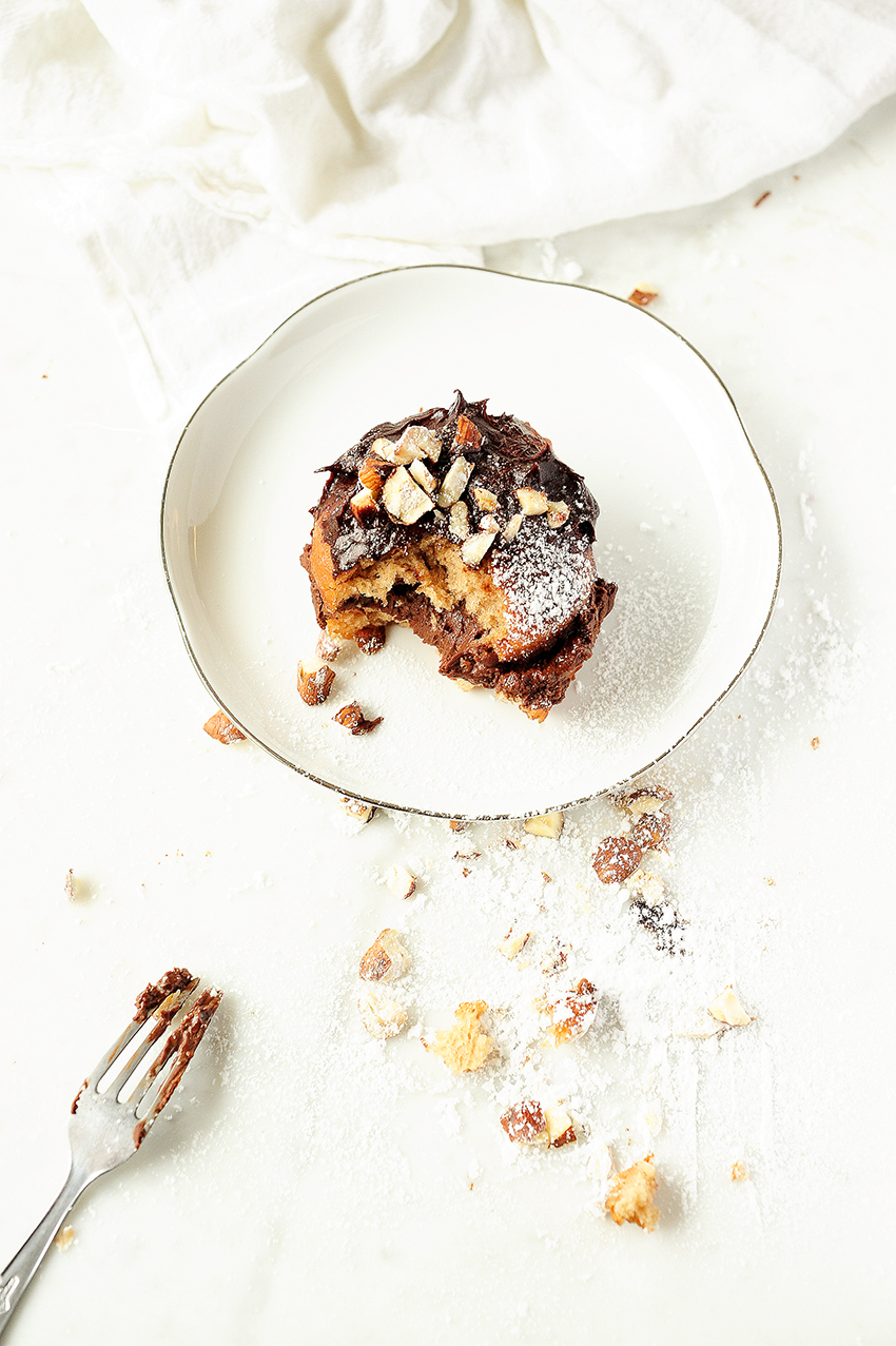 Polish donuts with chocolate mousse and hazelnuts