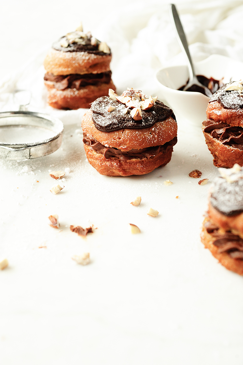 Polish donuts with chocolate mousse and hazelnuts