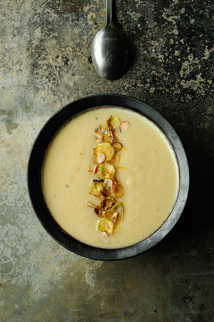 serving dumlings | Roasted cauliflower apple soup with crispy brussels sprouts and hazelnuts