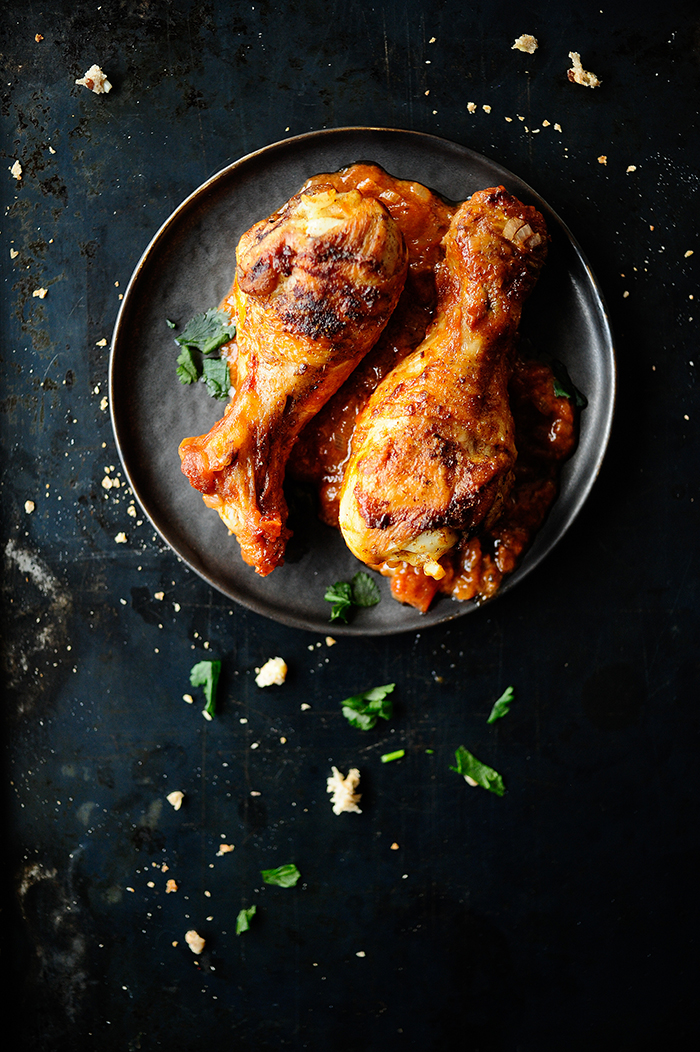 Drumsticks in tomato sauce with blueberries