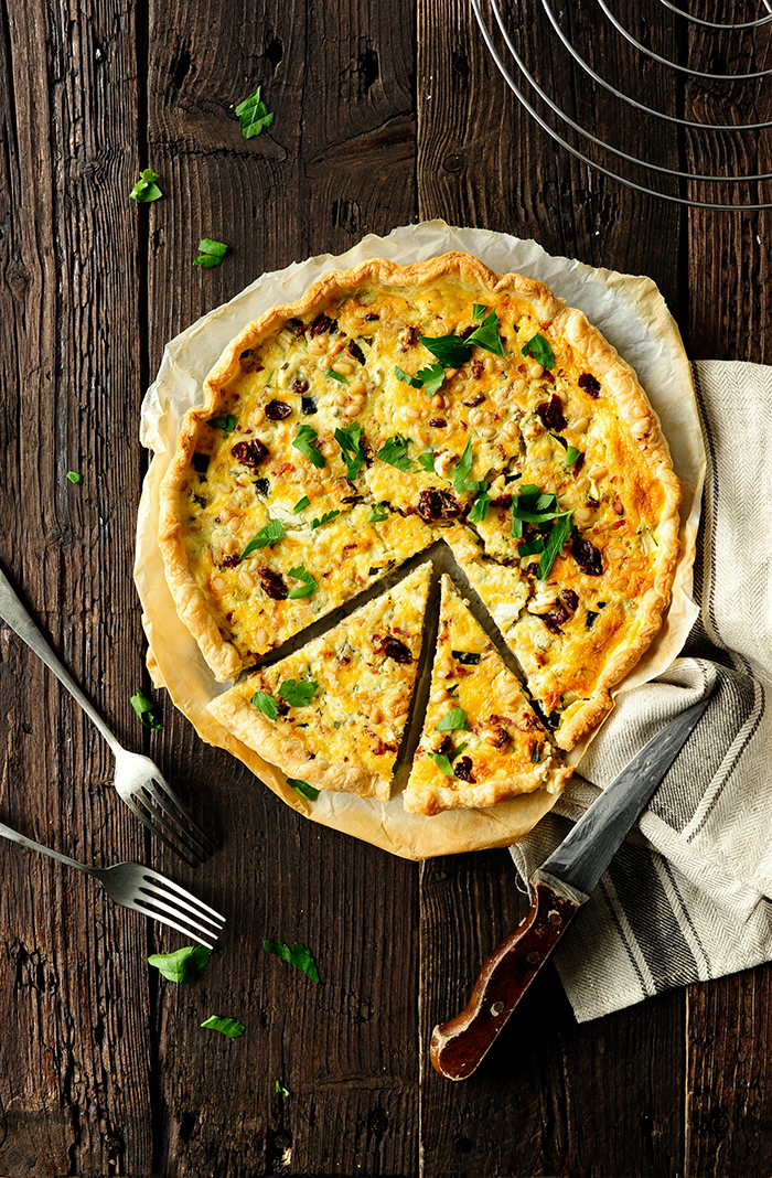 Quiche with bacon, zucchini and cranberries