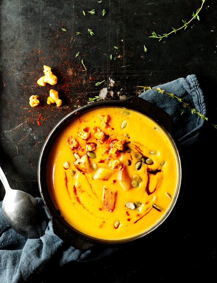 Pumpkin & sweet potato soup with caramelized apple and popcorn
