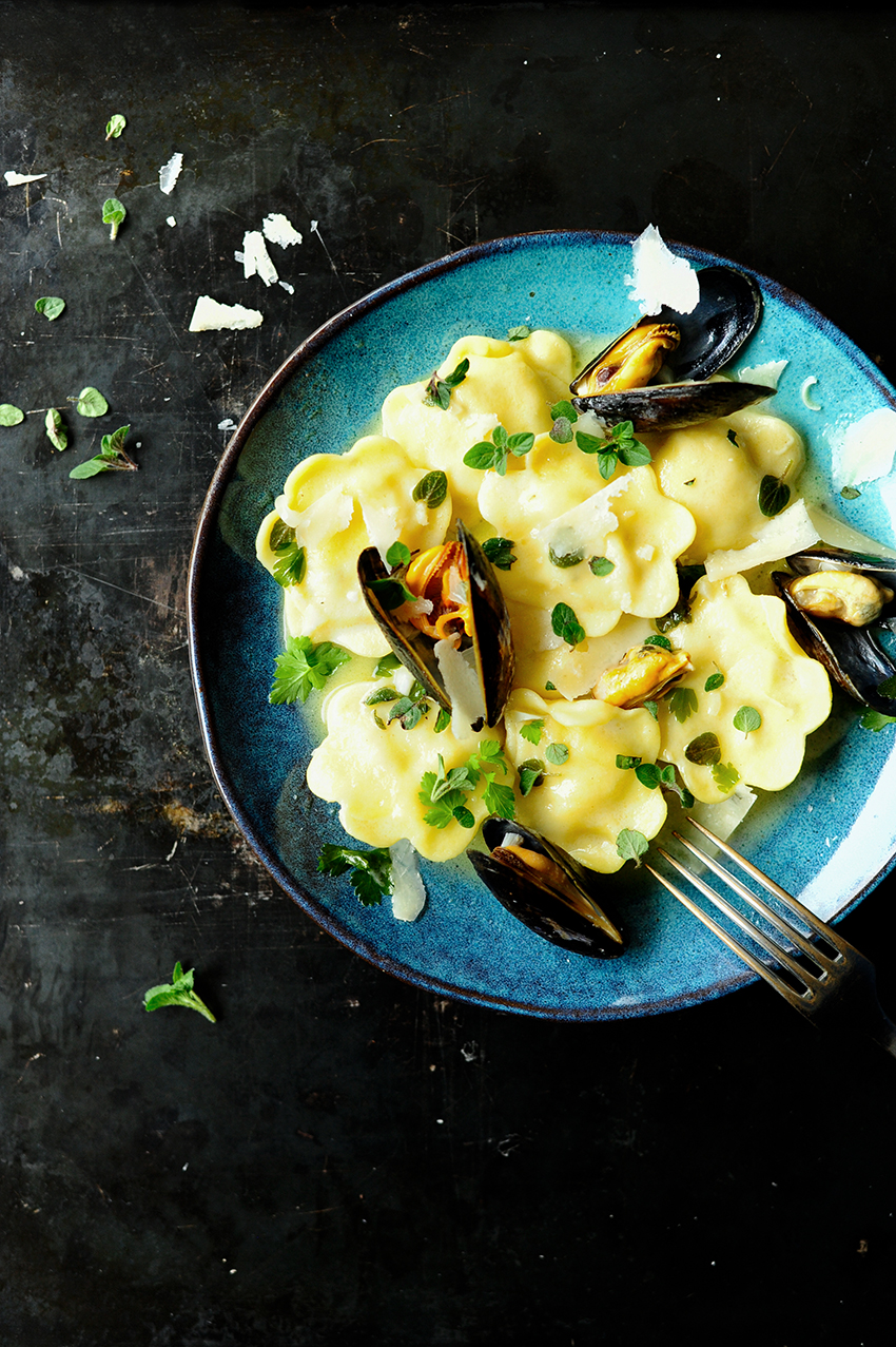 serving dumplings | Seafood ravioli with butter sauce 