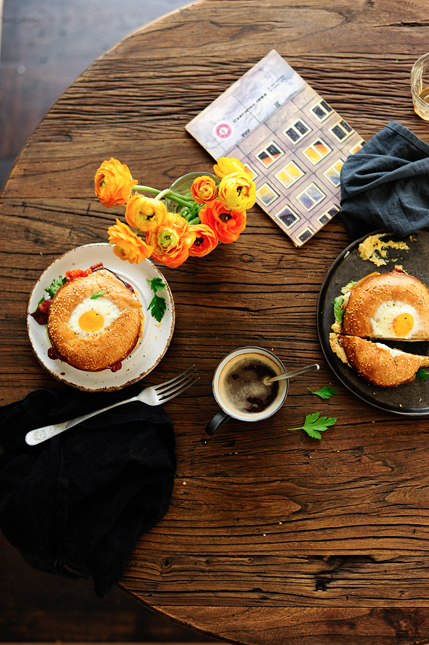 Bagel egg in a hole with hummus and roasted veggies