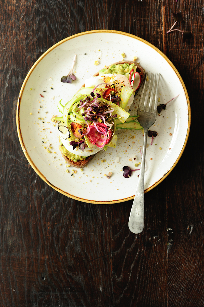 Shaved asparagus avocado toast with poached eggs and dukkah