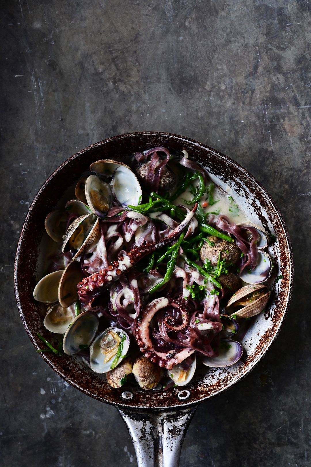 serving dumplings | Creamy garlic black pasta with clams and octopus