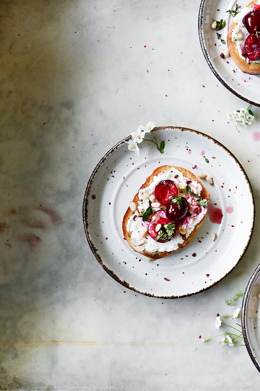 Goat cheese crostini with macerated cherries