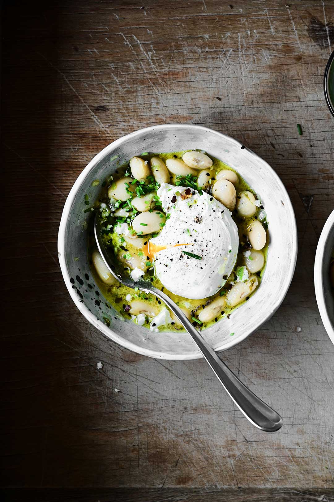 serving dumplings | White bean stew with feta and poached egg