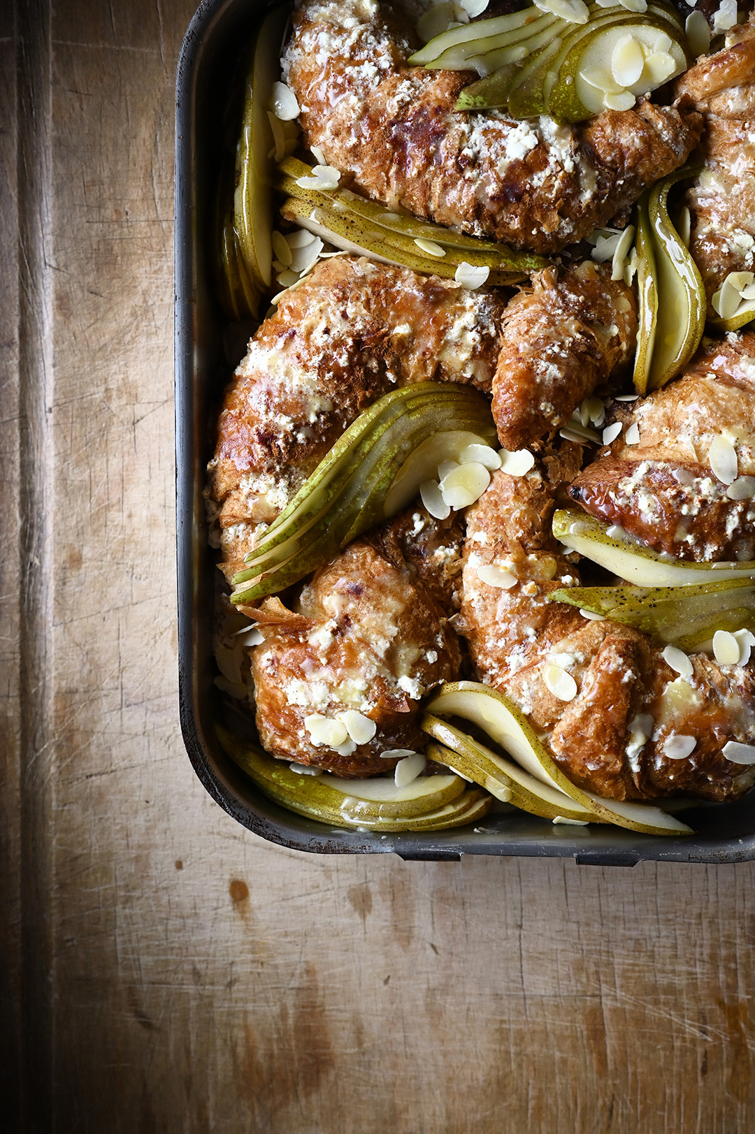 serving dumplings | Overnight pear and ricotta croissant French toast with almonds