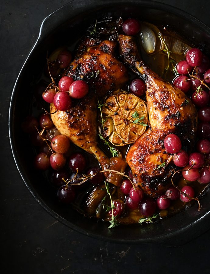 Roast chicken legs with garlic and grapes