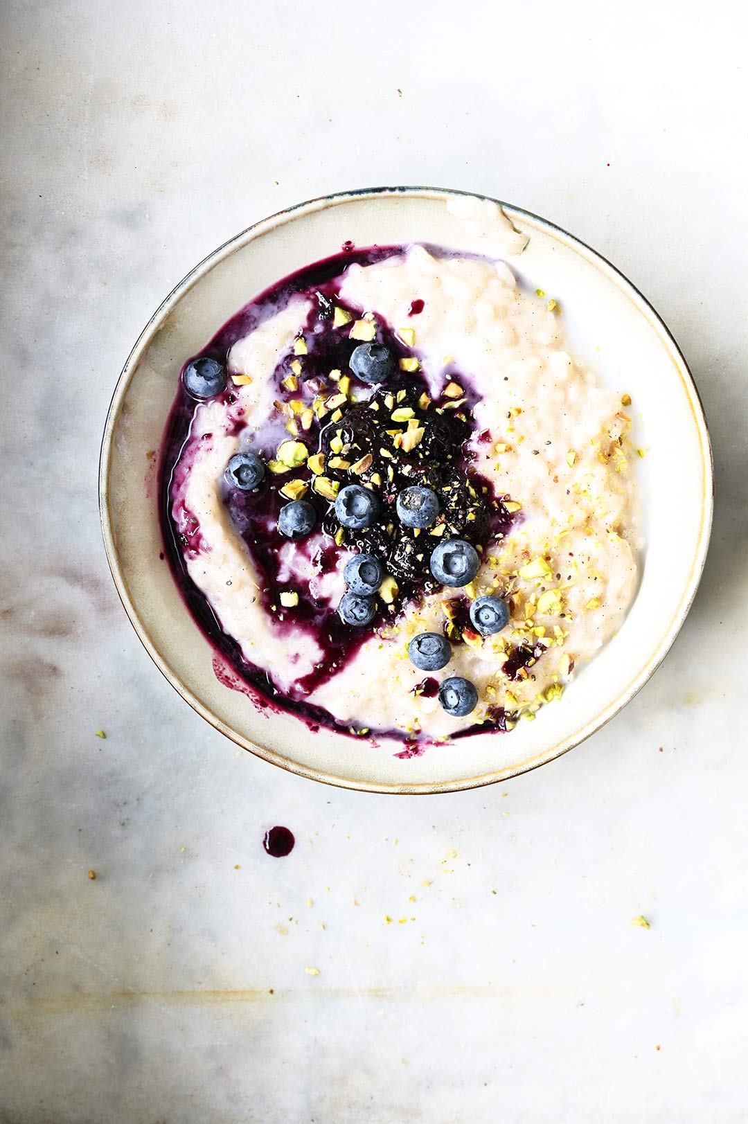 serving dumplings | coconut rice pudding with ginger blueberries