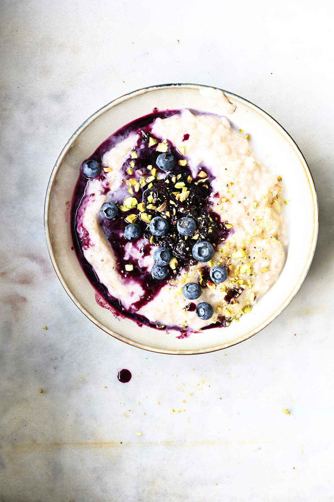 coconut rice pudding with ginger blueberries