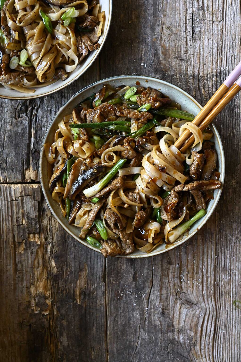 20 minute Beef and Shiitake Noodle StirFry Serving Dumplings
