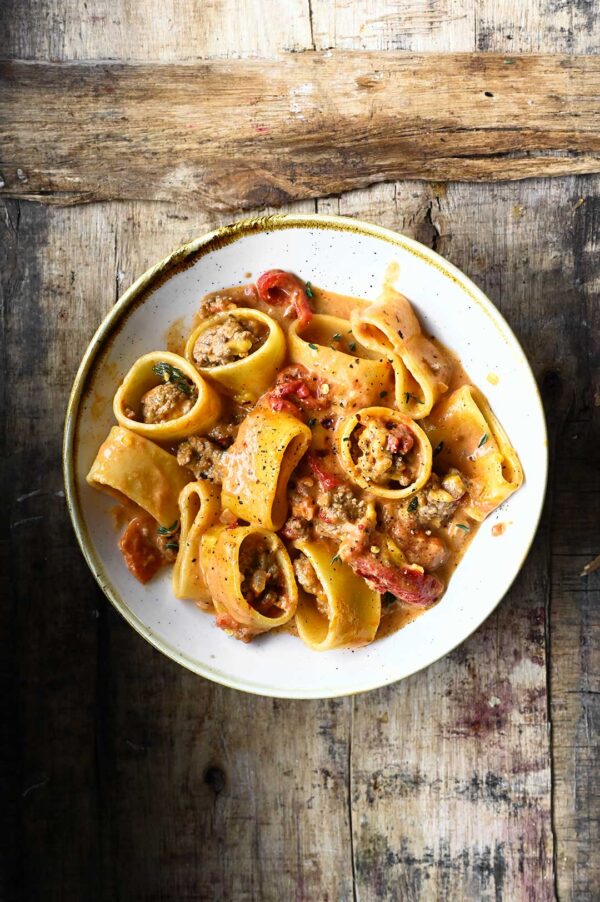 Creamy Beef Bolognese with Roasted Peppers Serving Dumplings