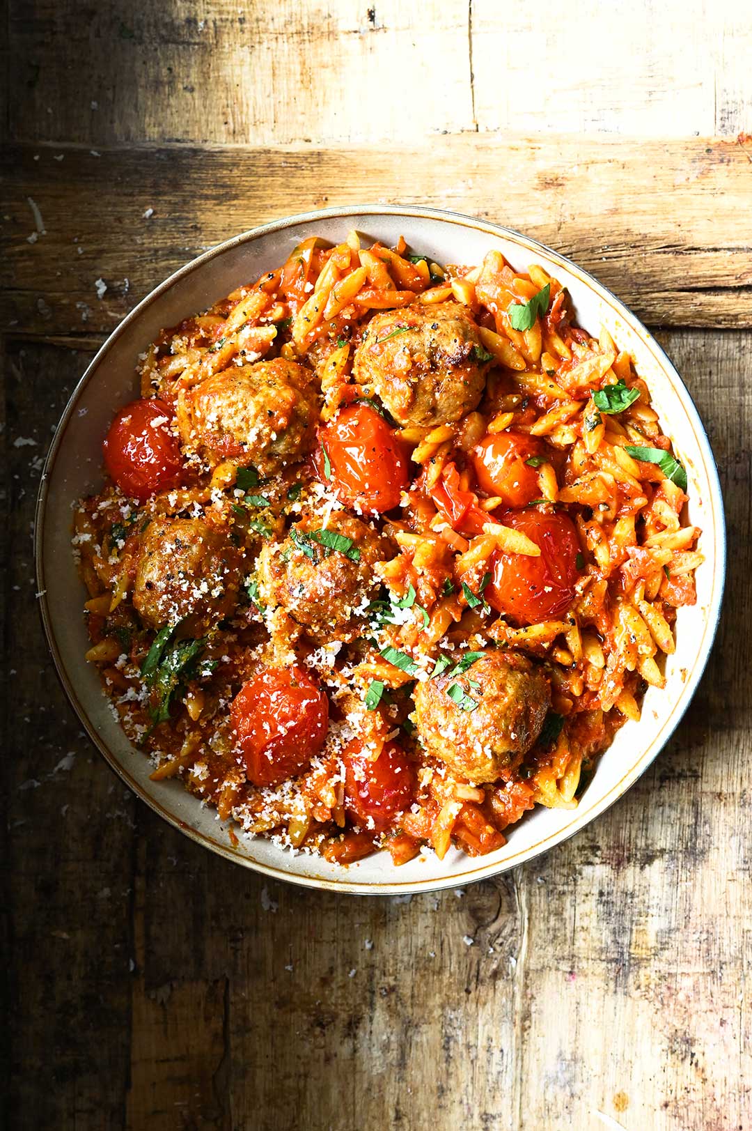 A good pinch of red chili flakes adds a little spice. Meatballs in tomato sauce with orzo