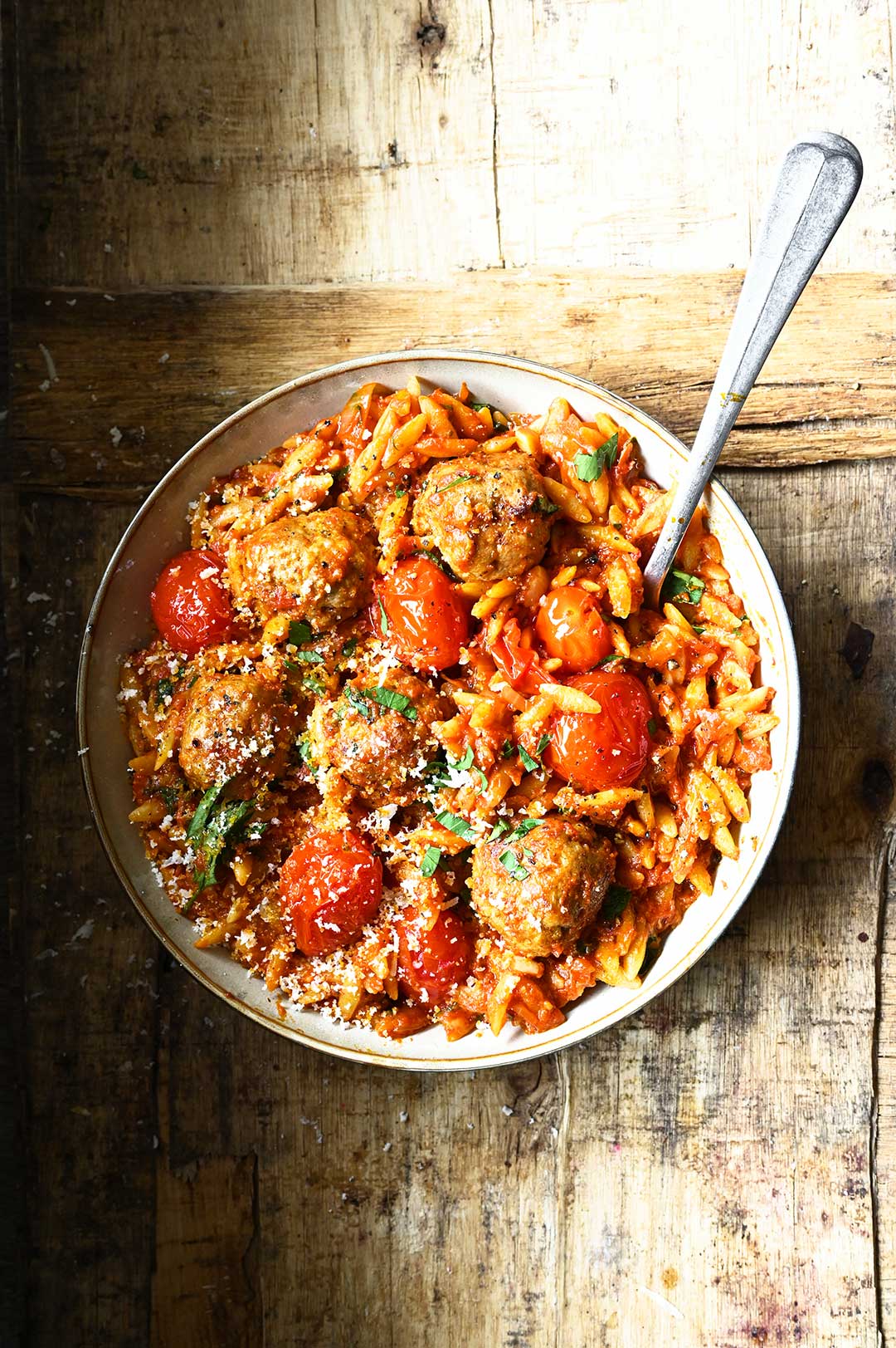 Meatballs in tomato sauce with orzo