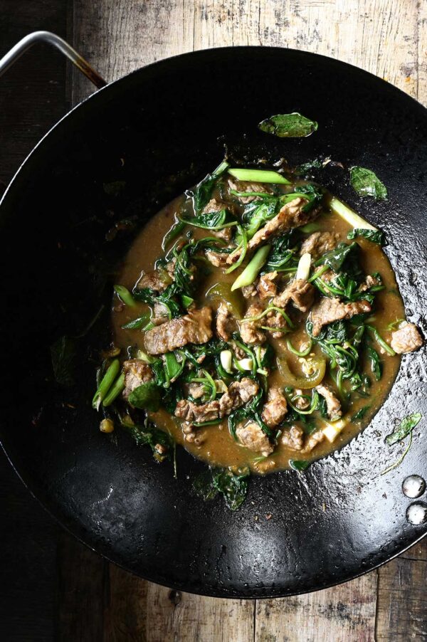 Spicy Beef and Spinach StirFry Serving Dumplings