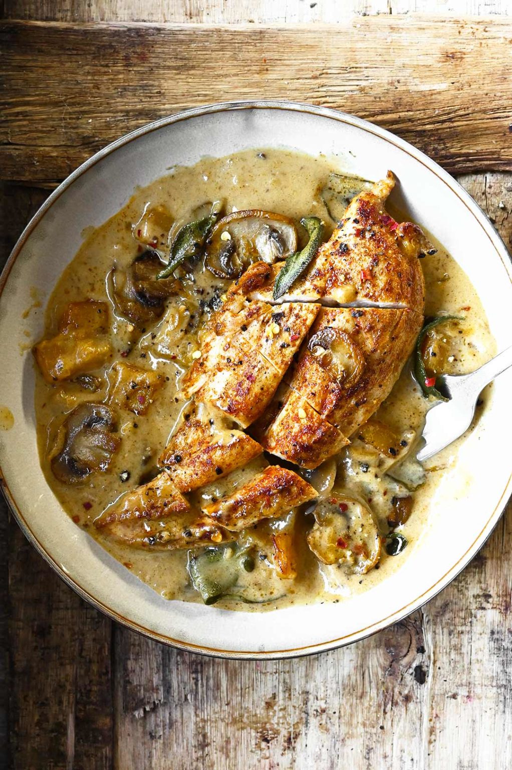 Chicken in Butternut Squash and Mushroom Cream Sauce Serving Dumplings