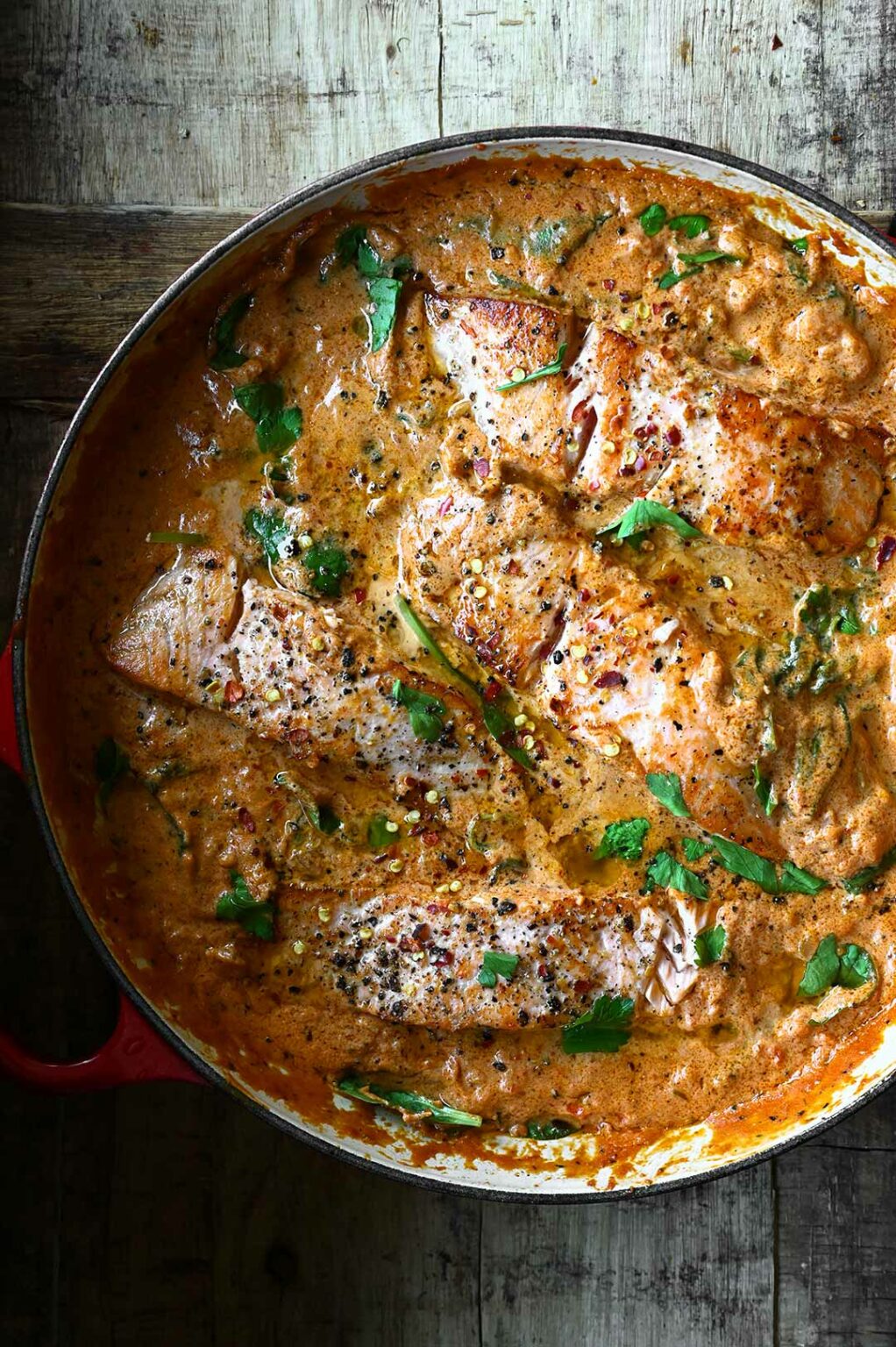 Salmon in Creamy Red Pesto Sauce Serving Dumplings