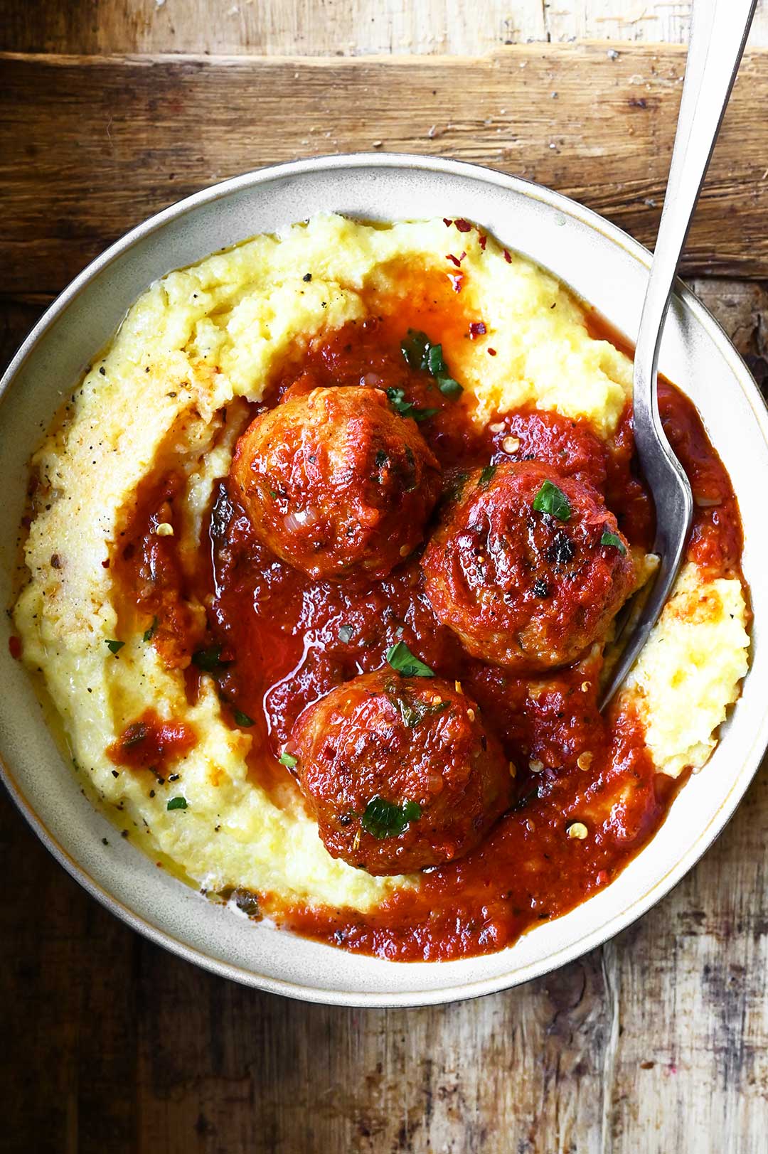 chicken meatballs all arrabbiata with polenta