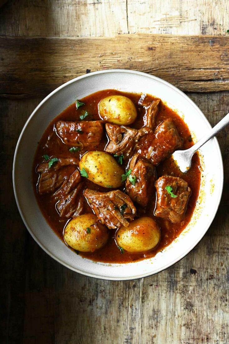 Hearty Beef and Potato Stew Serving Dumplings