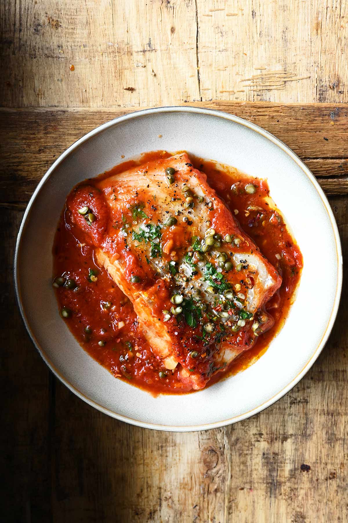 poached cod in peppery tomato sauce