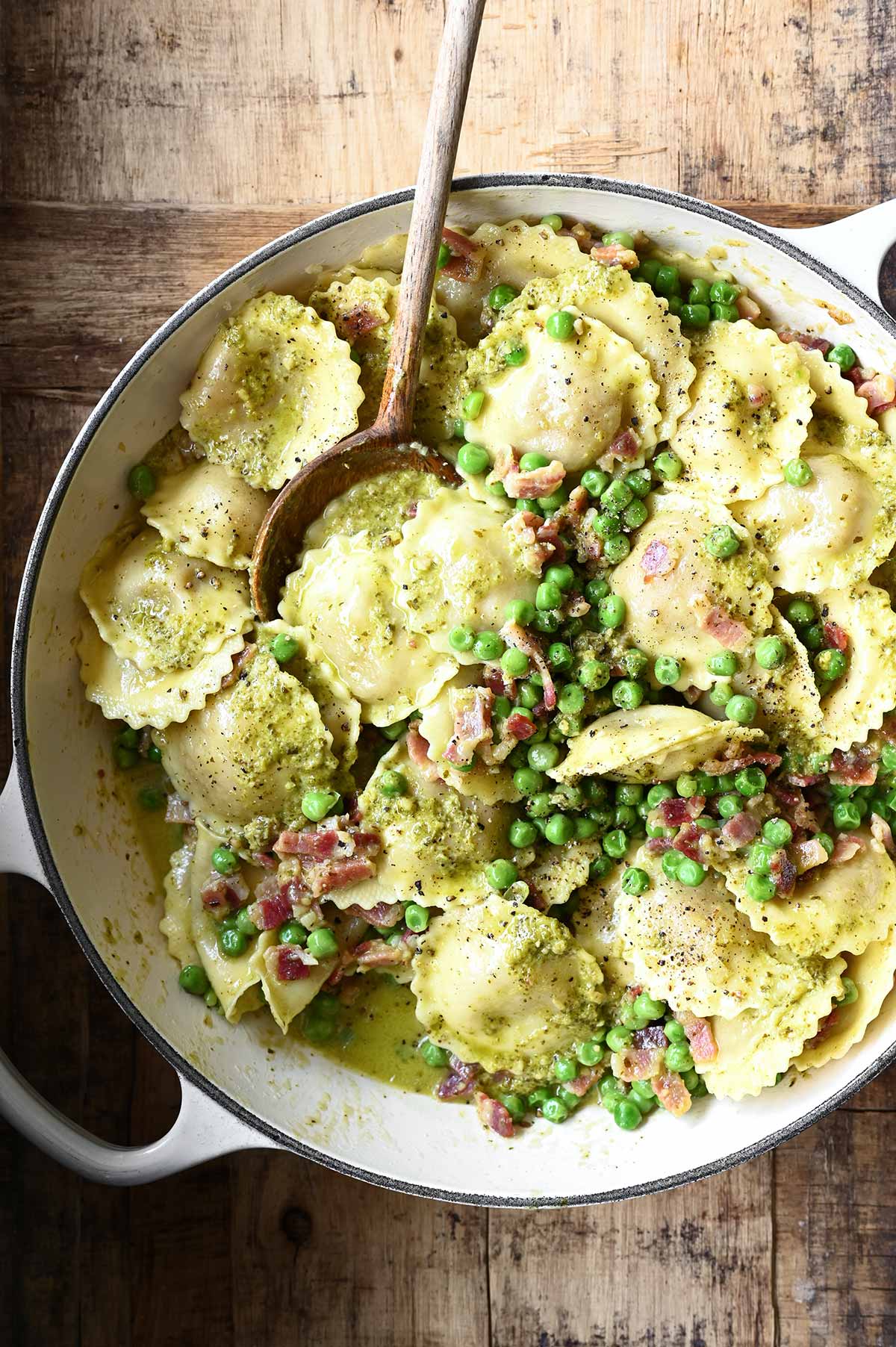 pesto ravioli with pancetta and peas