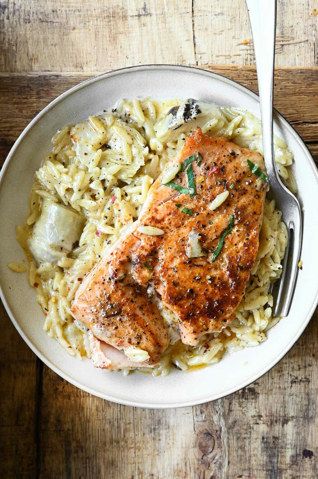 Salmon with Artichoke Orzo Serving Dumplings